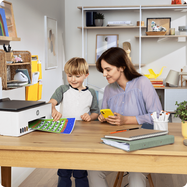 A family printing colorful pages at home